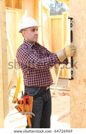 Worker with a spirit level