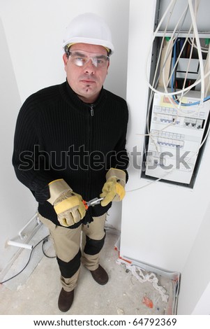 Electrician in a room under construction