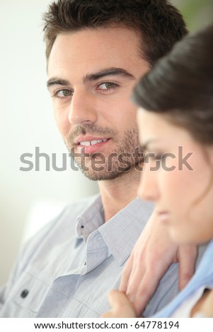 Portrait of a man sitting near a woman