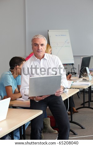 Computer teacher in classroom