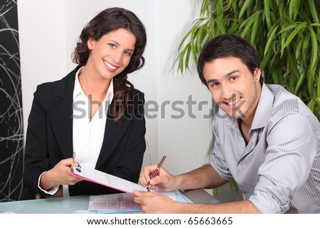 Portrait of a man and a woman in a meeting