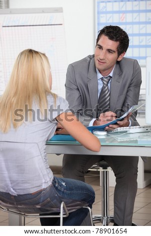 Young woman in interview with trainer