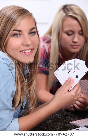 two girls playing cards
