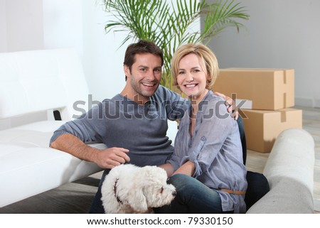 Couple and dog move in to new home