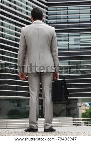 Businessman with gray suit, back view