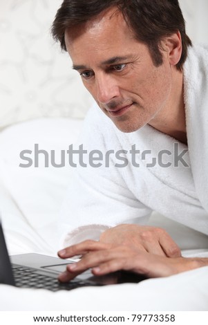 Man working in dressing gown.