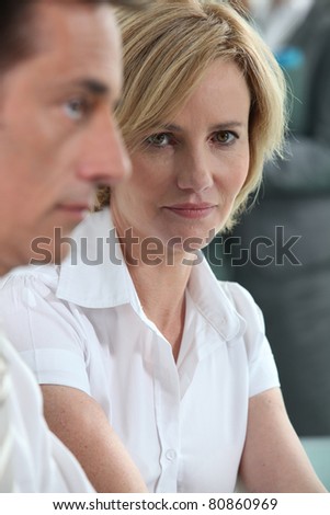 Serious woman in meeting