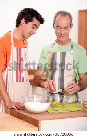senior and junior cooking together