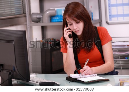 Woman laborer on phone scheduling an appointment