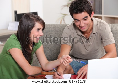 male and female student working together