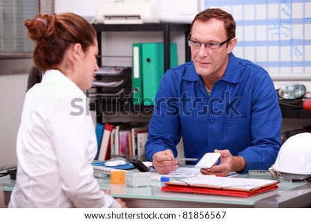 Office manager talking to customer