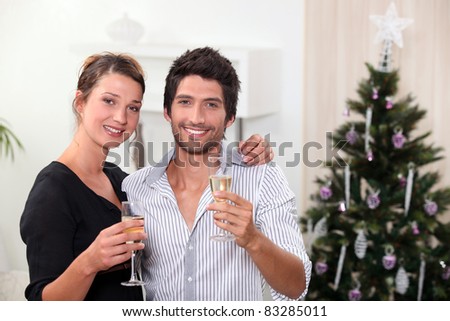 young couple celebrating New Year\'s Eve