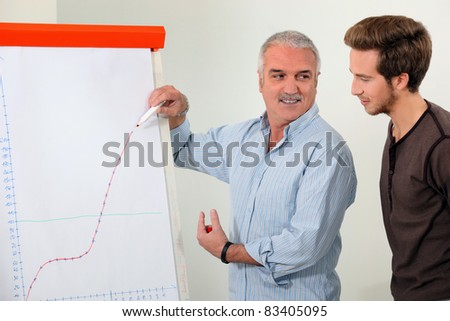 Man explaining a growth chart