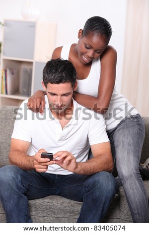 Couple looking at mobile phone