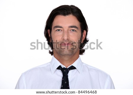 Head and shoulders of a man in a shirt and tie