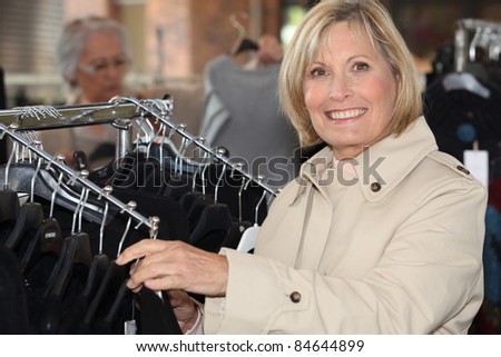 blonde lady doing shopping in a clothes shop