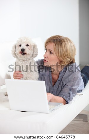 woman with laptop and dog