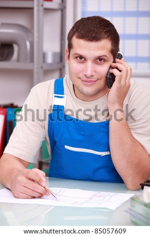 Technician on phone in office