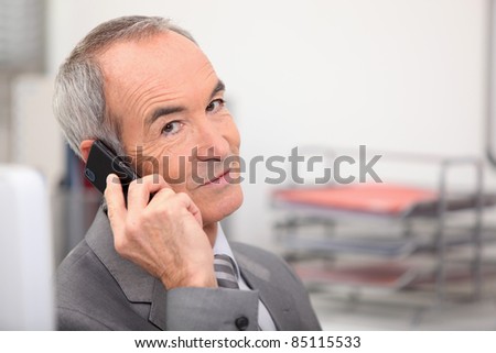 Admin worker with mobile telephone