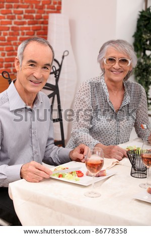 old couple eating at a restaurant