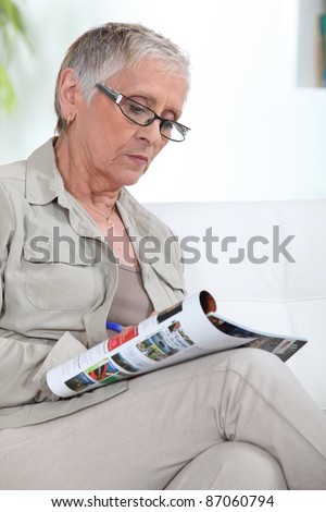 older lady reading magazine