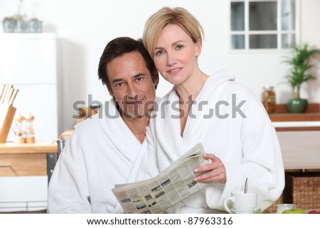 Couple reading the newspaper