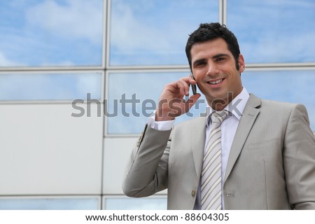 Office worker on phone outdoors