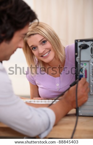 Computer technician with colleague