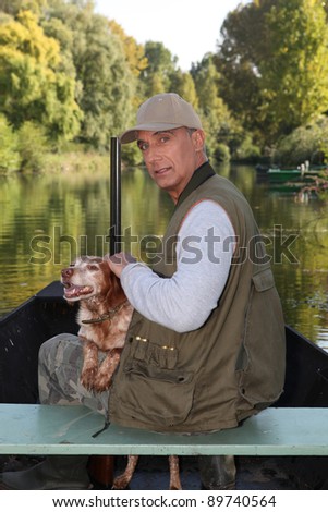 Hunter on a boat with his dog