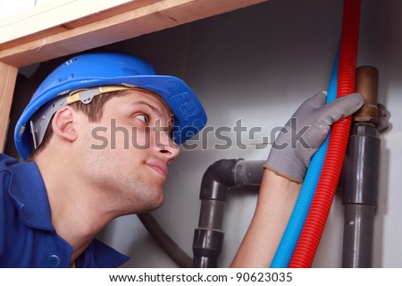 Plumber with hot and cold flexible water pipes