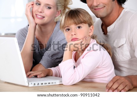 Family in front of laptop