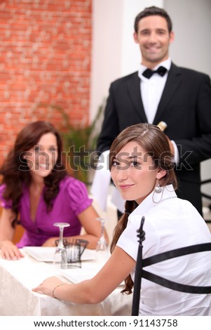 Two female friends in restaurant