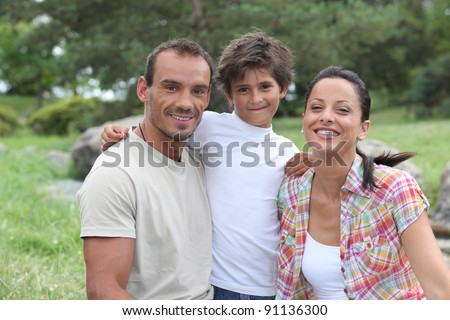 parents and their son on mountain walk