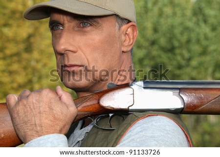 hunter with rifle outdoors