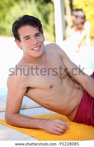 stock photo Teenager lying on the beach