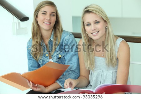 Students sat on stairs revising