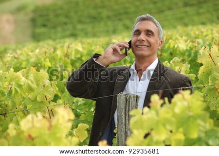 stock photo : Indian mature business man with mobile phone stock photo a mature man over the phone in a vineyard 92935681 stock photo : Indian mature business man with mobile phone