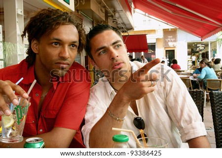 men having a drink on a terrace