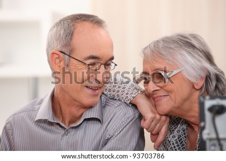 Smiling elderly couple at home