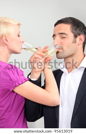 man and woman drinking champagne with love