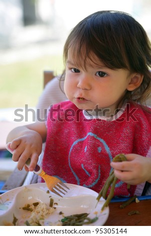 Toddler eating lunch