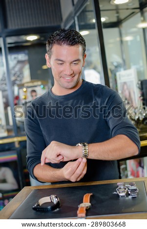 Man shopping for a watch