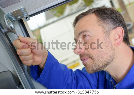 Man installing a garage door