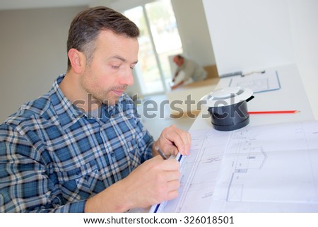 Builder going over construction plans