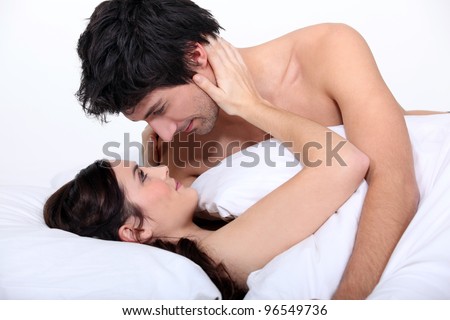 Couple staring lovingly into each other\'s eyes