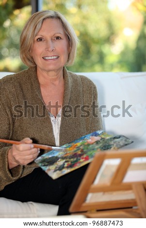 50 years old woman painting