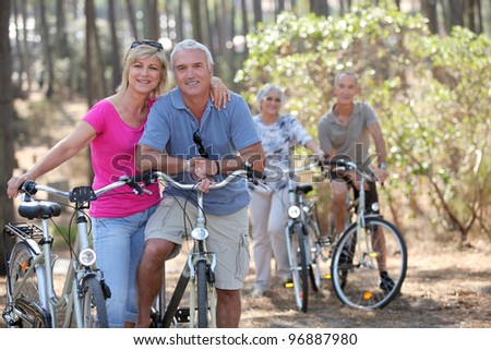 Two elderly couples on bike ride