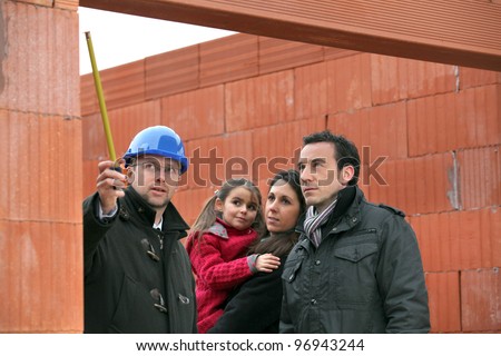 Architect on site with a young family