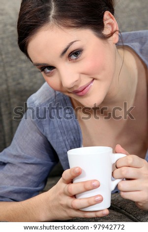 Young woman with a mug of tea