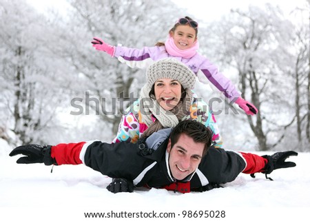 Family playing in the snow